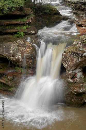 Upper Falls Flow at Old Mans Cave - The Upper Falls, a waterfall at Old Man’s Cave, cascades over a cliff of sandstone after heavy spring rains in Hocking Hills State Park, Ohio.