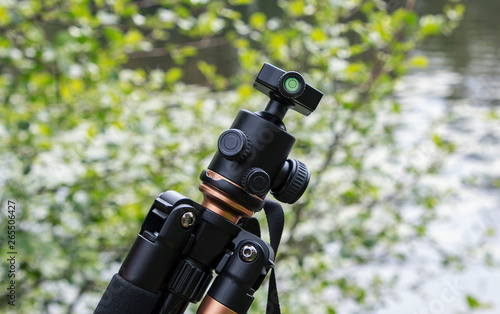 Wallpaper Mural tripod for a camera with a 3D head in nature Torontodigital.ca