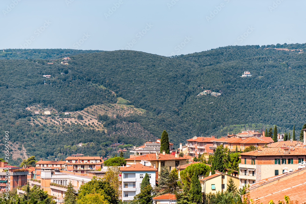 Perugia Umbria, Italy cityscape with roof of town village orange colors in sunny summer day high angle aerial view by mountains
