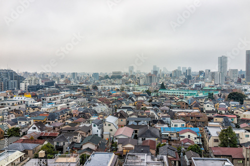 Shinjuku  Tokyo dark gloomy cityscape with view apartment buildings residential area on cloudy  grey stormy and overcast day with many houses