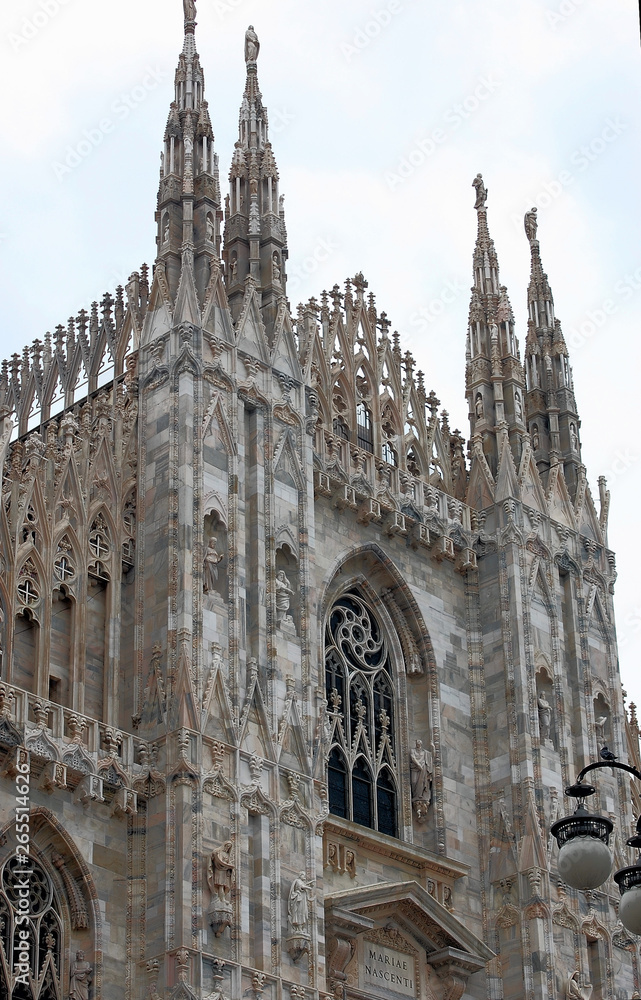 detail of the facade of the catholic cathedral in milan