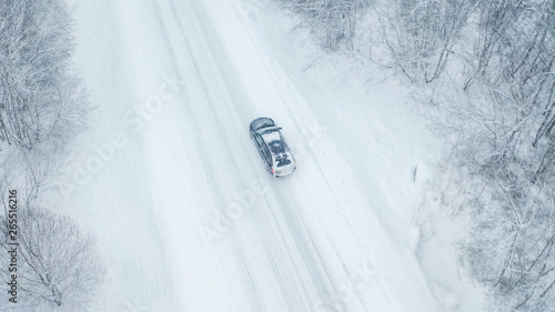 22073_Aerial_view_of_the_black_car_during_the_raining_of_snow25.jpg