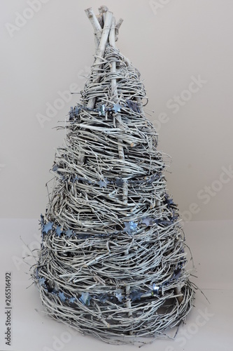 A handmade white christas tree made of birch twigs and decorated with a blue chain and stars photo