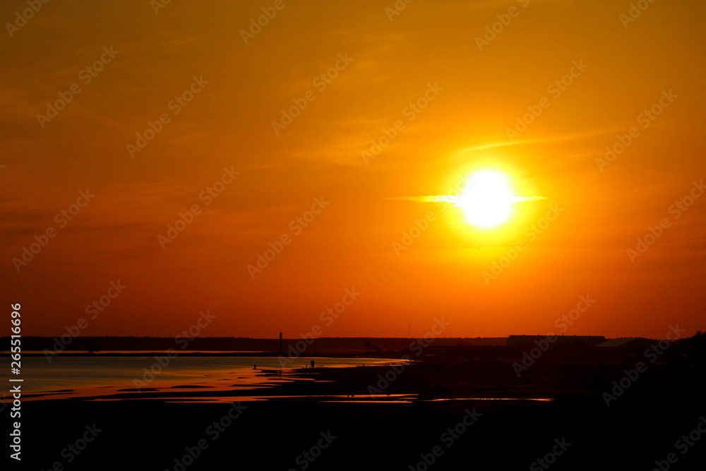 twilight sun over the baltic sea coast, Parnu, Estonia