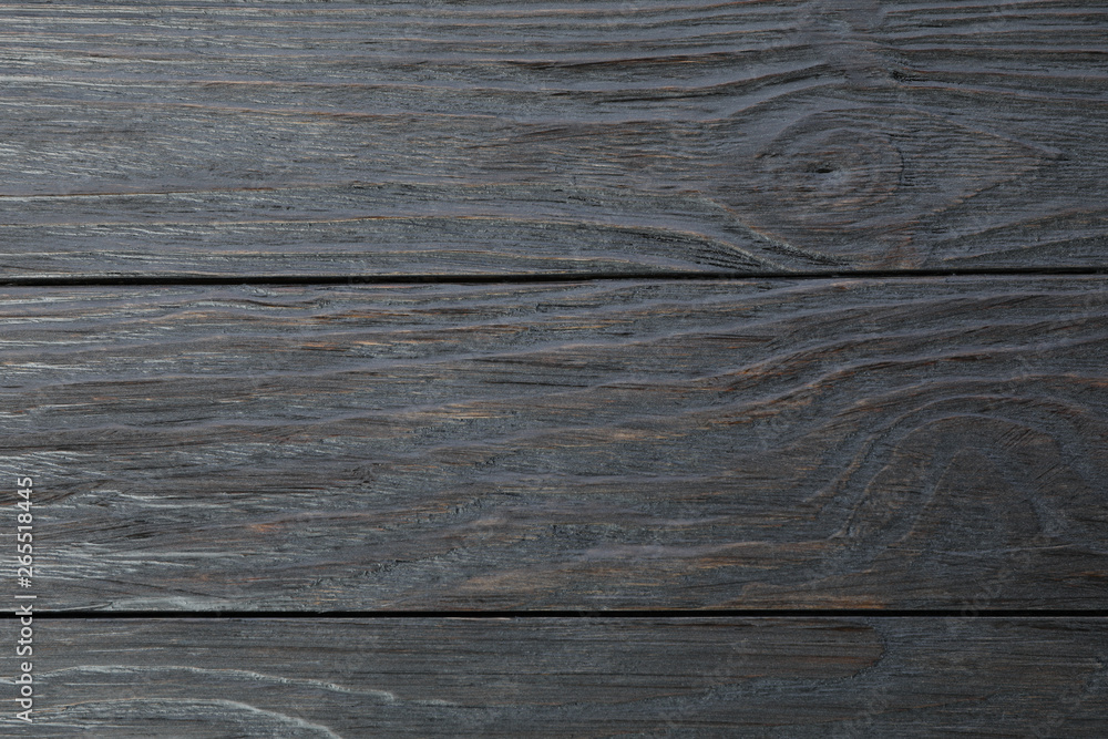Naklejka premium Dark wooden background. Space for text, closeup