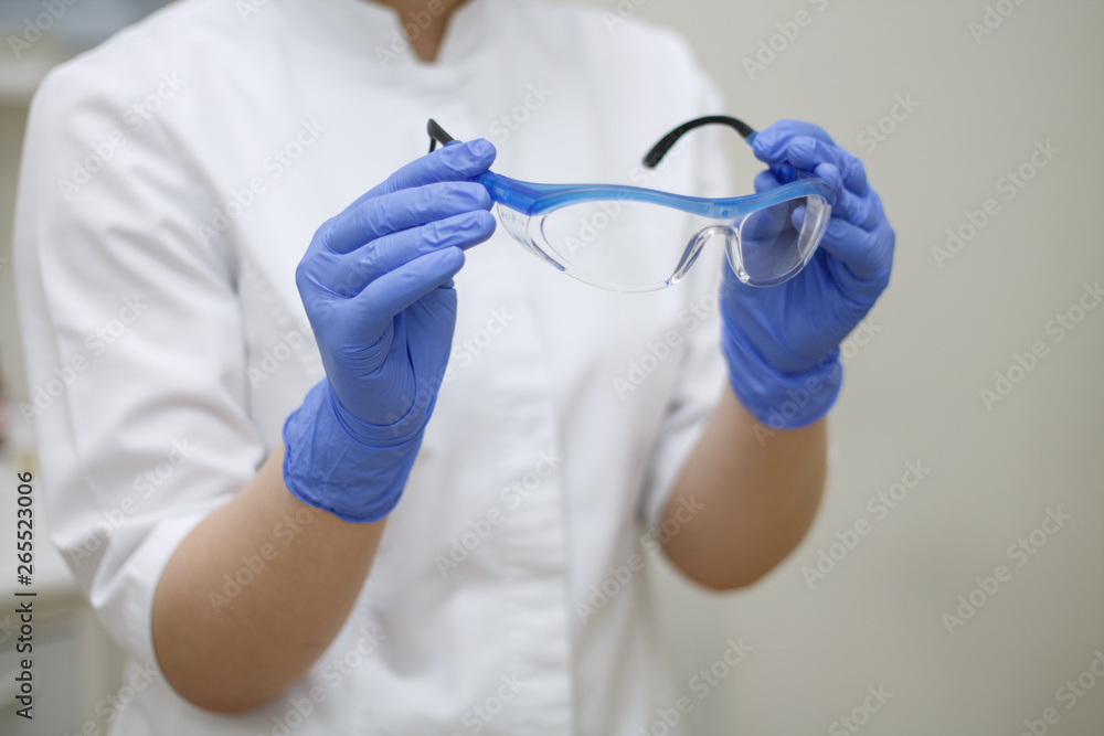 dental instruments in hand glasses blue glove on dentistry background dental instruments in hand glasses blue glove on dentistry background
