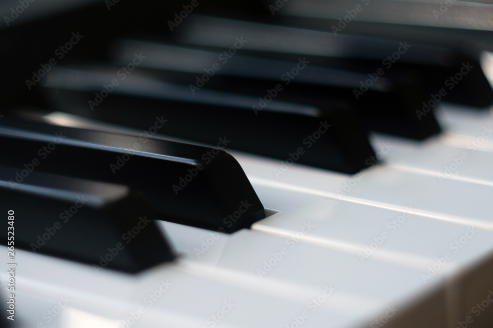 Electric piano keyboard close up background with selective focus