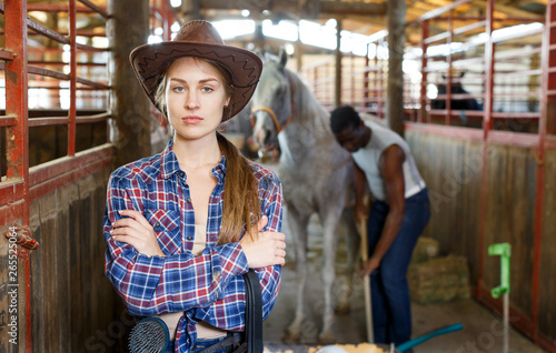 Portrait of woman horse farm worker