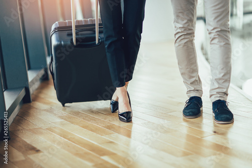 Businessman and businesswoman hold luggage travel to business trip. © Mediteraneo