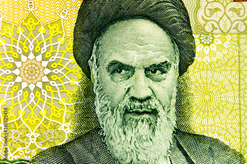 Portrait of Ayatollah Khomeini close-up on banknote 100 000 Iranian rials.