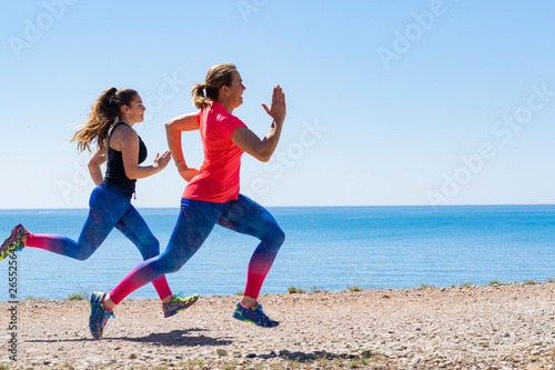 Two Runners Sprinting Outdoors