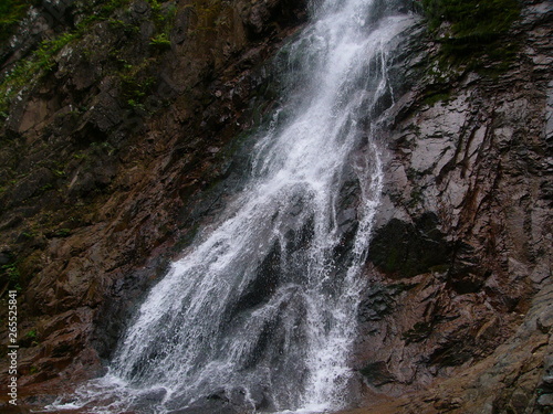 waterfall in the mountains, a mountain river with a waterfall