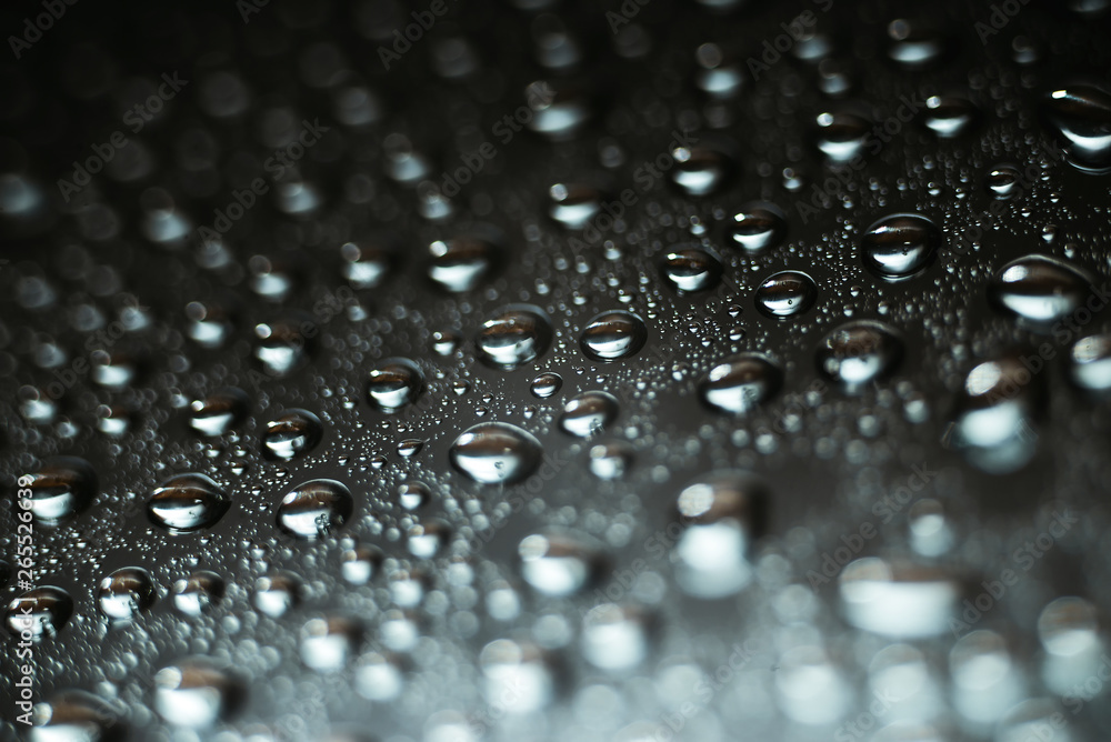 Water droplets on chrome metallic surface, abstract macro