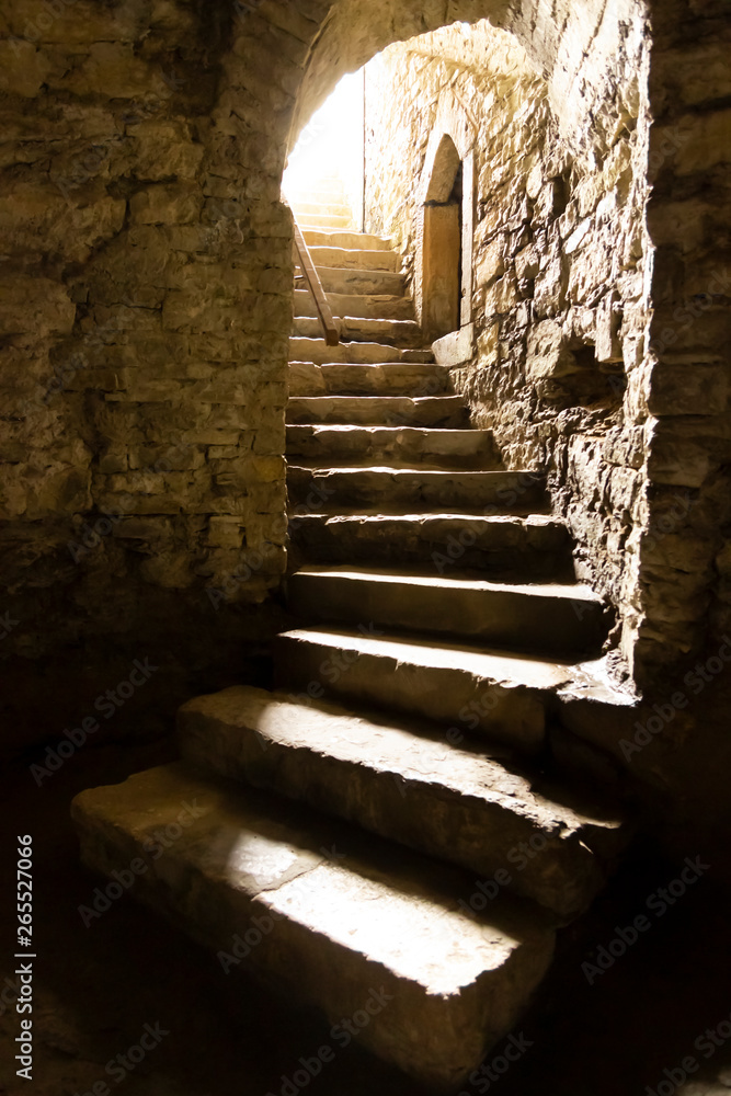 Fototapeta premium Old stony stairway from the ancient underground cave