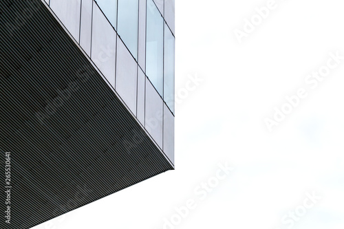 Clouds reflected in windows of modern office building.