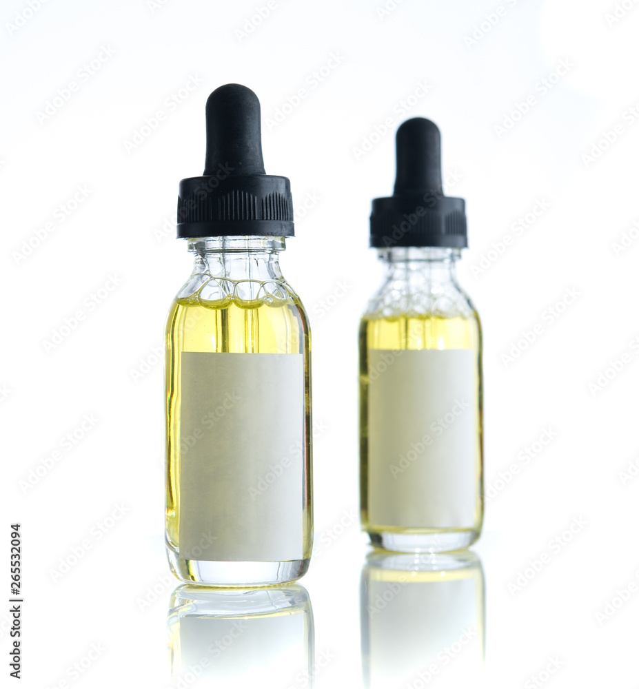 Bottle of essential oil with blank label isolated over the white background for print design and mock up Bottle of essential oil with blank label isolated over the white background for print design and mock up