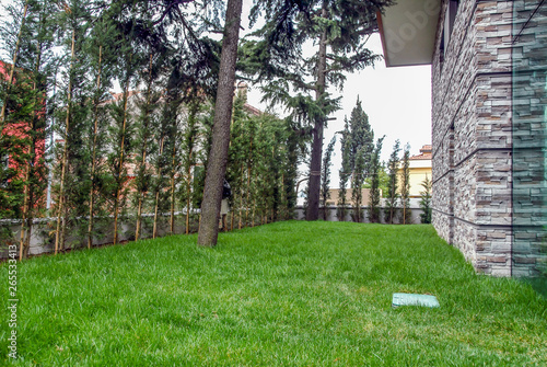 Istanbul, Turkey, 19 March 2015: Beautiful exterior of newly built luxury home. Yard with green grass.