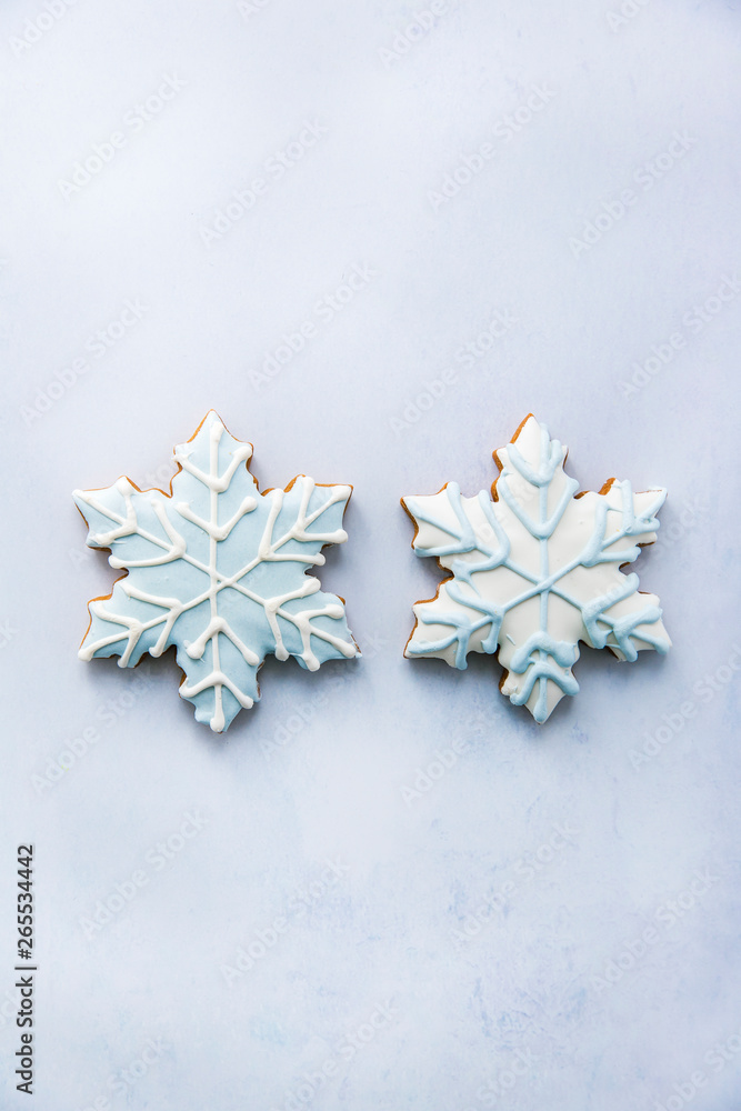 Two frosted gingerbread snowflake Christmas cookies Two frosted gingerbread snowflake Christmas cookies
