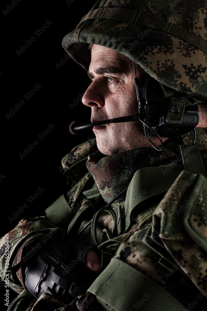 Fototapeta premium Soldier special forces with rifle on dark background 