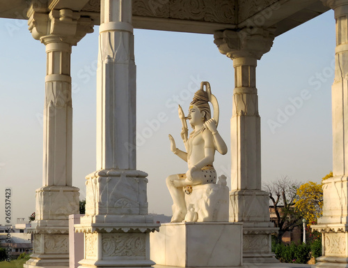 Marble statue of Lord Shiva under a canopy near the Lakshmi Narayana Temple in Jaipur, India. photo