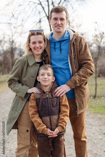 portrait of lovely young family outdoors