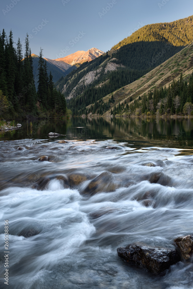 Rapids of Lower Kolsai Lake river at sunrise in the Kungey Alatau mountains Kazakhstan