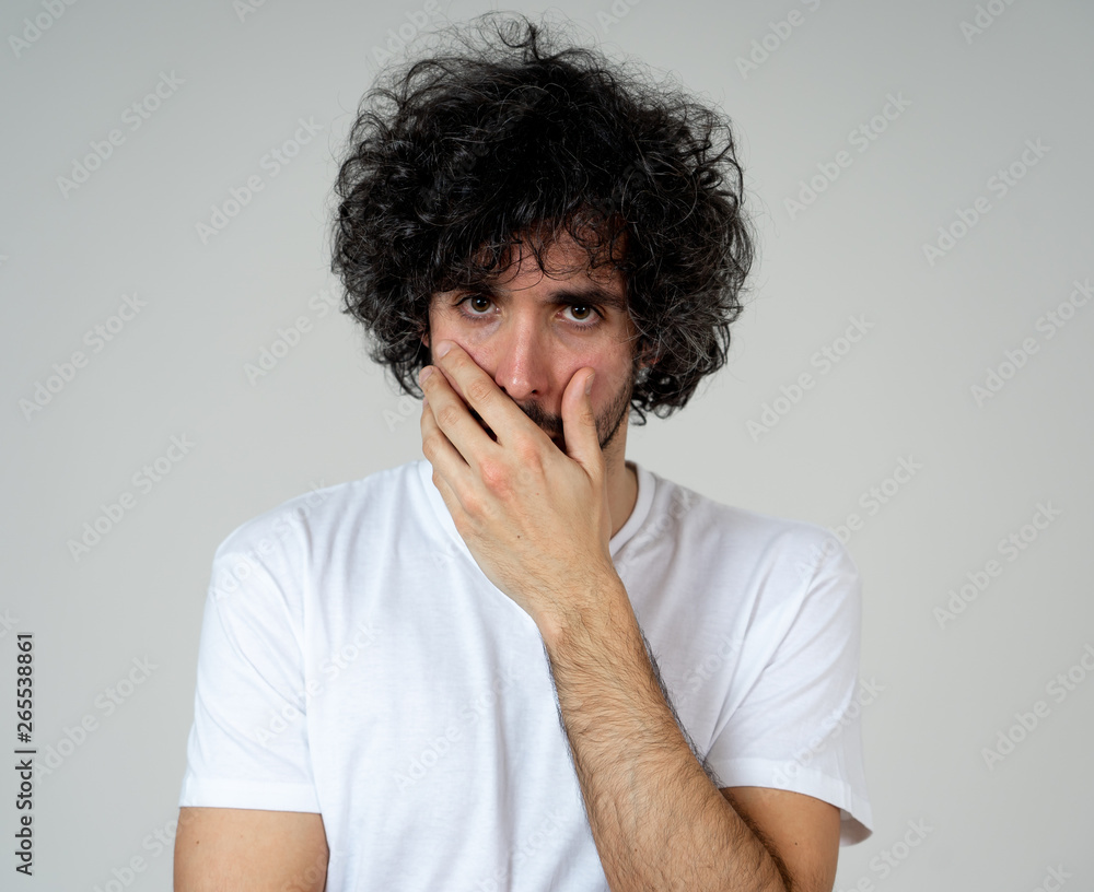 Portrait of sad and intimidated man. Isolated in white background. Human expressions and emotions - obrazy, fototapety, plakaty 