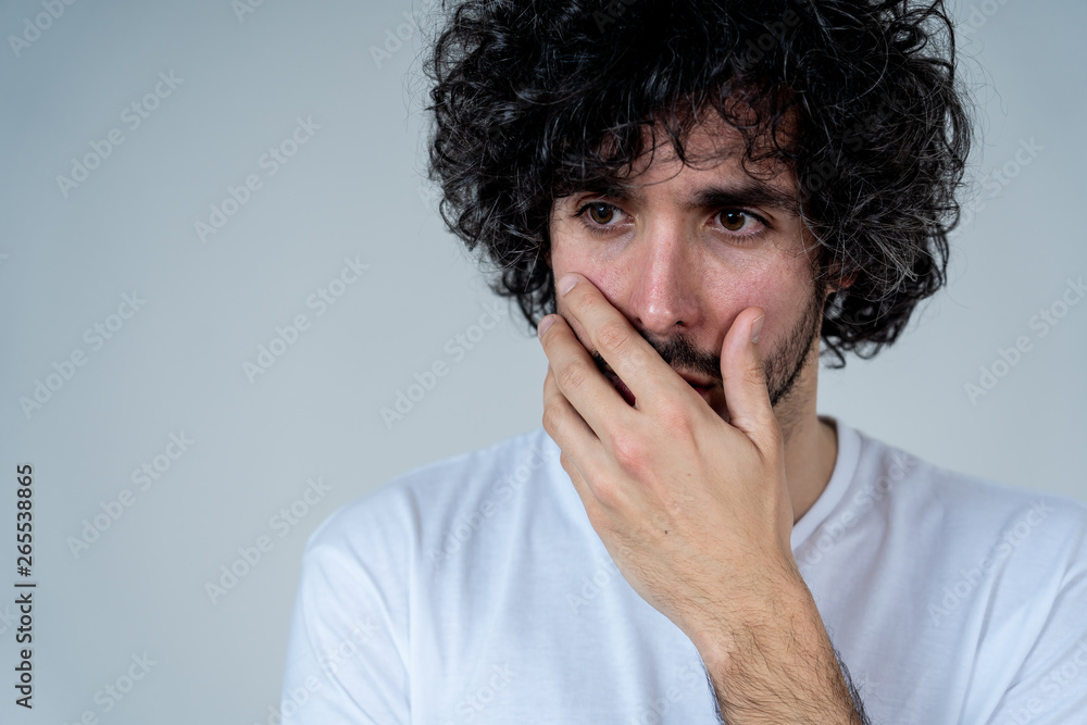 Portrait of sad and intimidated man. Isolated in white background. Human expressions and emotions Portrait of sad and intimidated man. Isolated in white background. Human expressions and emotions