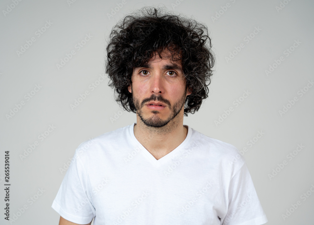 Portrait of sad and intimidated man. Isolated in white background. Human expressions and emotions Portrait of sad and intimidated man. Isolated in white background. Human expressions and emotions