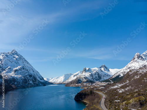 Road along fjord and mountain with snow cap in Norway © Keerathi