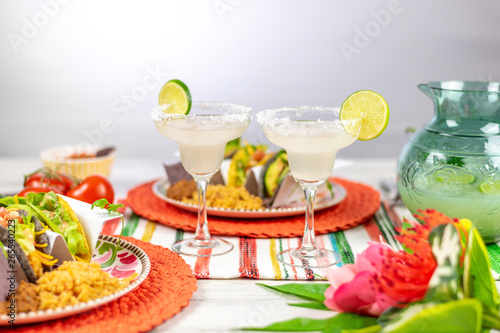 Margaritas with salt and limes and mexican food
