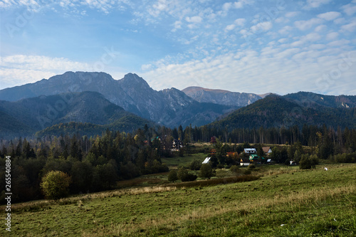 Rural landscape with mountains and houses