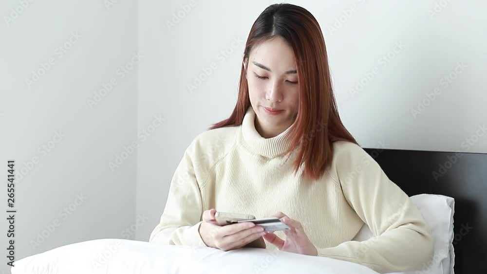 Beautiful Asian woman use smart phone for online shopping Beautiful Asian woman use smart phone for online shopping