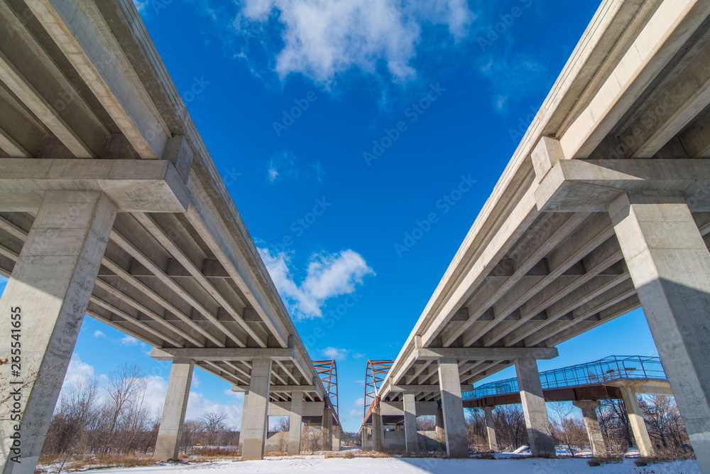 Underside state highway bridges that go over the Minnesota River south of the Twin Cities - great straight lines, symmetry, and blue skies Underside state highway bridges that go over the Minnesota River south of the Twin Cities - great straight lines, symmetry, and blue skies
