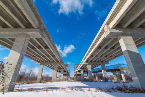 Underside state highway bridges that go over the Minnesota River south of the Twin Cities - great straight lines, symmetry, and blue skies #265541630