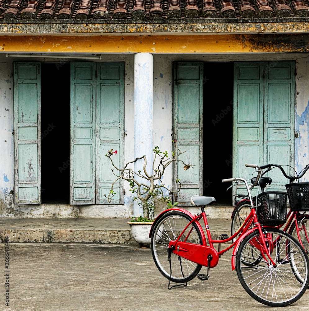 Bicycles parked outside old house Bicycles parked outside old house