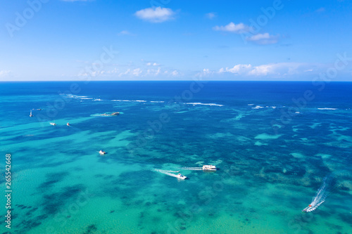 Aerial view from drone on caribbean sea with floating boats and yachts, tropical destination © photopixel