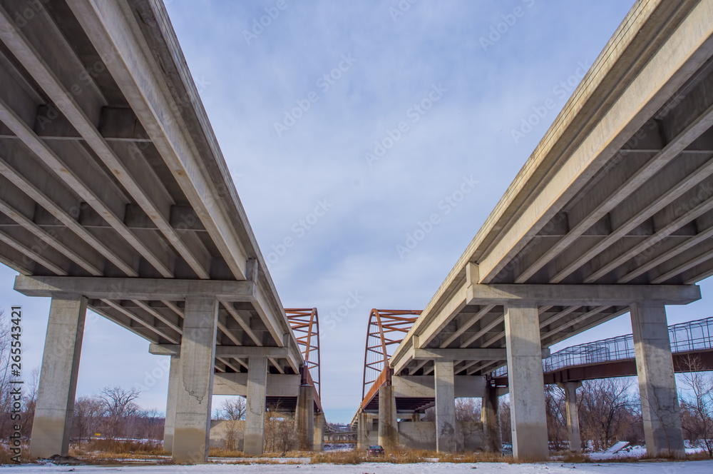 Underside state highway bridges that go over the Minnesota River south of the Twin Cities - great straight lines, symmetry, and blue skies Underside state highway bridges that go over the Minnesota River south of the Twin Cities - great straight lines, symmetry, and blue skies