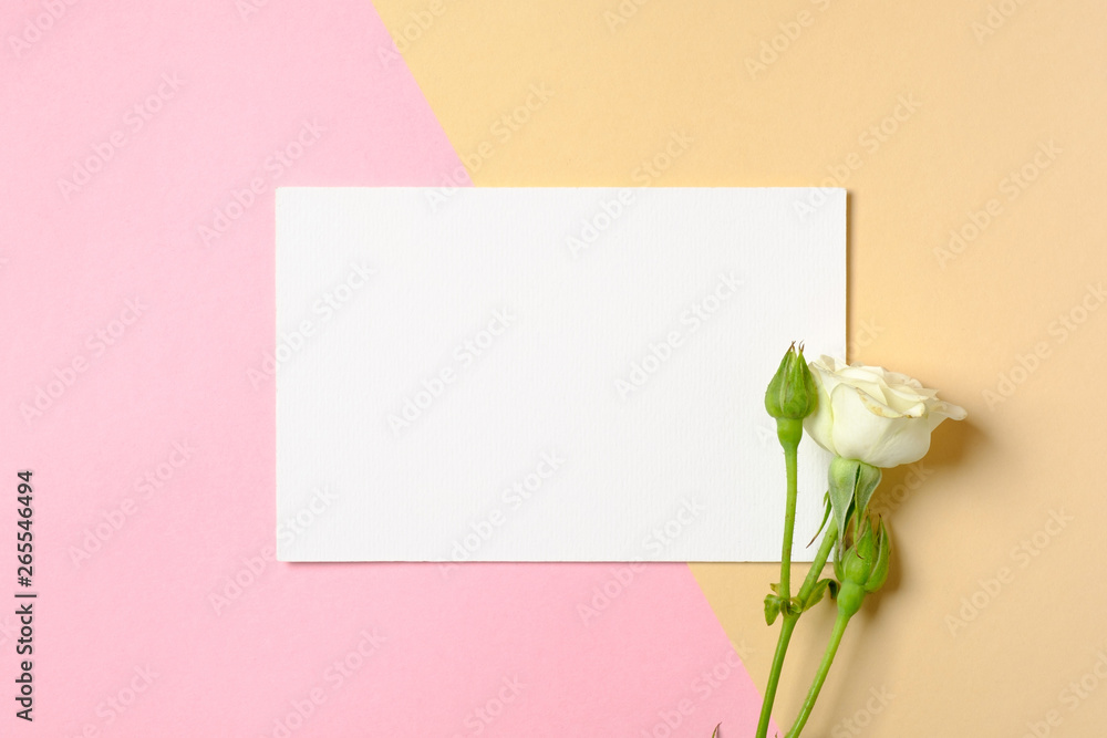 Blank paper card with copy space and white roses flowers on colorful background. Concept of love, tenderness, dating, freshness. Women desk. Creative minimal design. Blank paper card with copy space and white roses flowers on colorful background. Concept of love, tenderness, dating, freshness. Women desk. Creative minimal design.