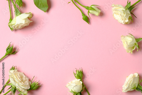 Anniversary congratulation flower background. Frame border made of white roses flowers with copy space. Flat lay style composition  creative layout. Top view  overhead. Tenderness and beauty concept.