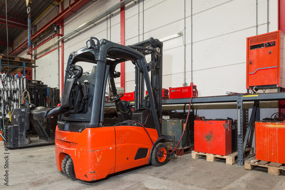 Forklift machinery and shelves in warehouse Forklift machinery and shelves in warehouse