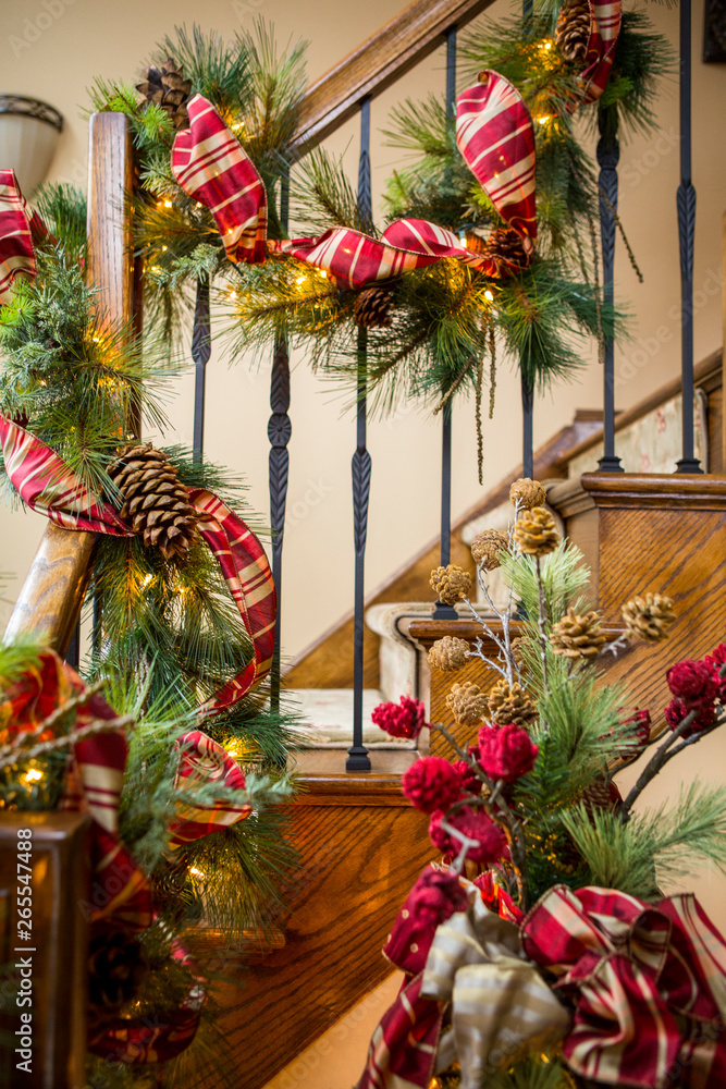 Banister decorated with boughs and string lights for Christmas Banister decorated with boughs and string lights for Christmas