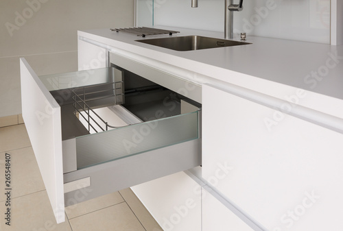 Open drawer in modern kitchen photo