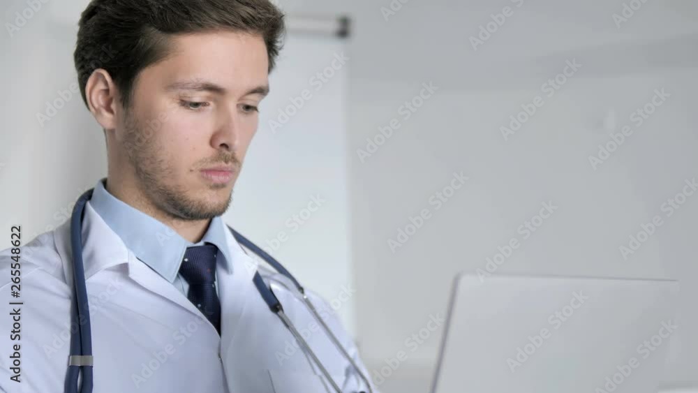 Close Up of Doctor Working On Laptop in Clinic Close Up of Doctor Working On Laptop in Clinic