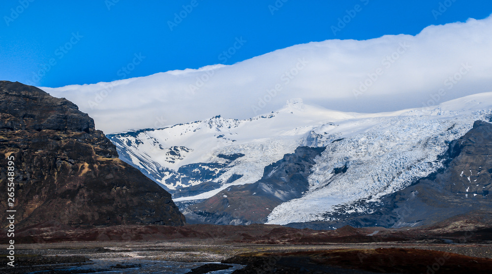 Icelandic landscape. Snowy mountain peak.