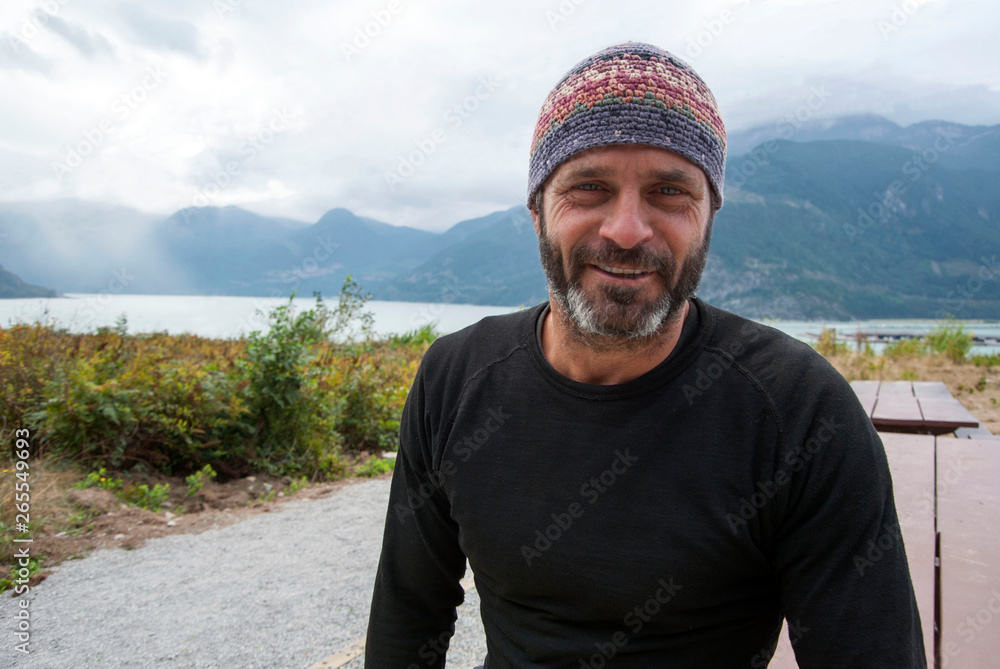 Smiling man wearing beanie hat outdoors Smiling man wearing beanie hat outdoors