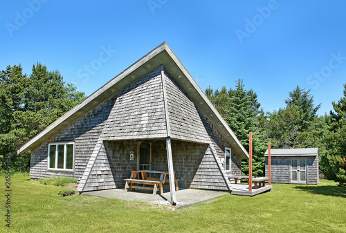 Modern house and lawn under blue sky photo