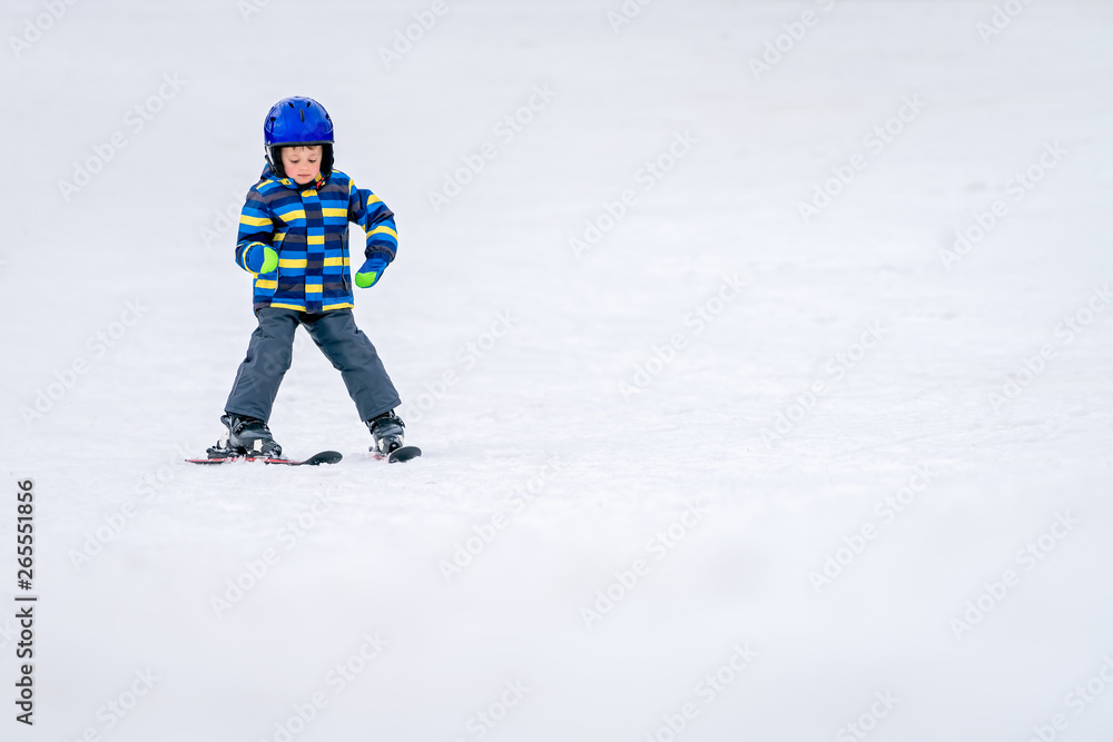 Little boy skiing for the first time
