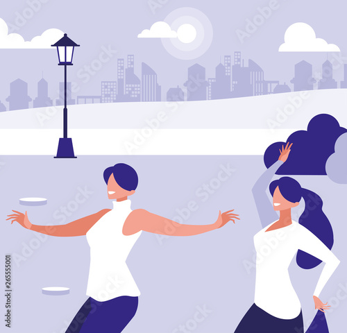 young interracial girls dancing in the park