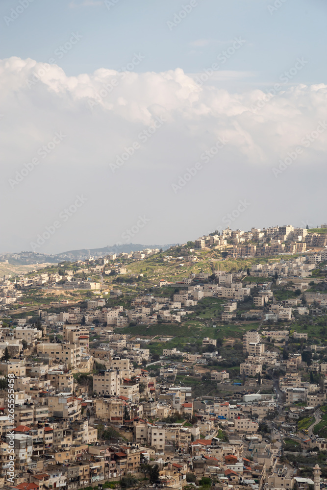 Aerial cityscape view of Jabal Batin alHawa residential neighborhood during a cloudy day. Taken in Jerusalem, Israel.